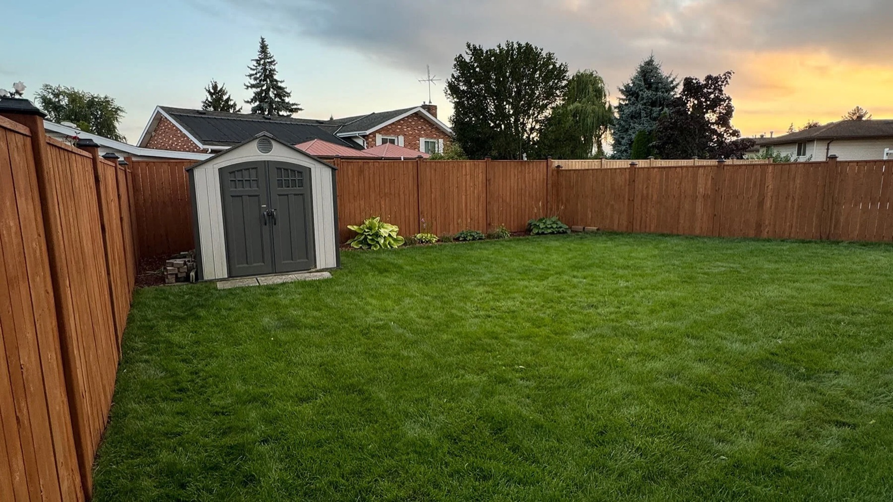 Backyard fence staining for a LaSalle property Backyard fence staining for a LaSalle property